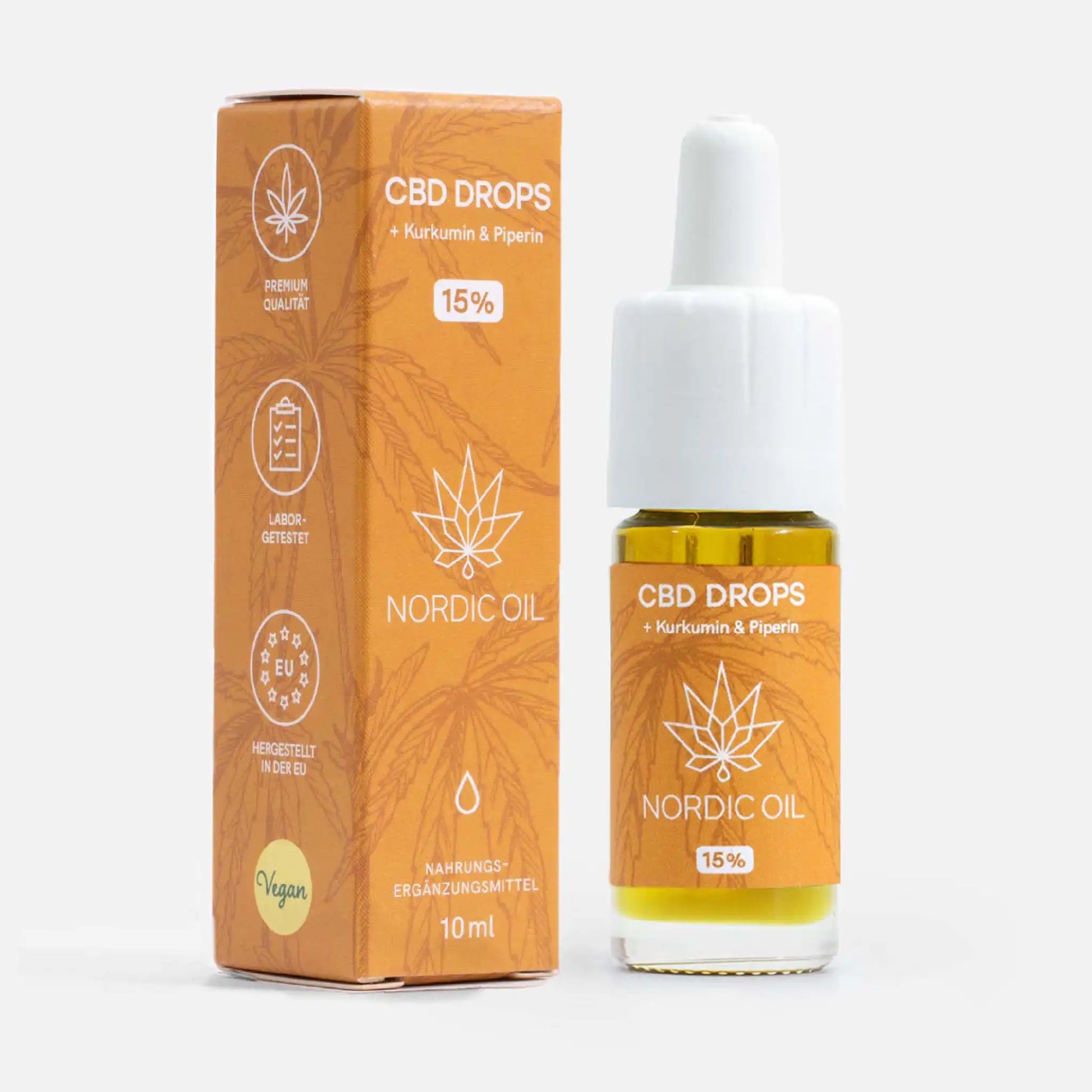 CBD Öl mit Kurkumin (15%) Flasche mit Kurkuma neben der Verpackung