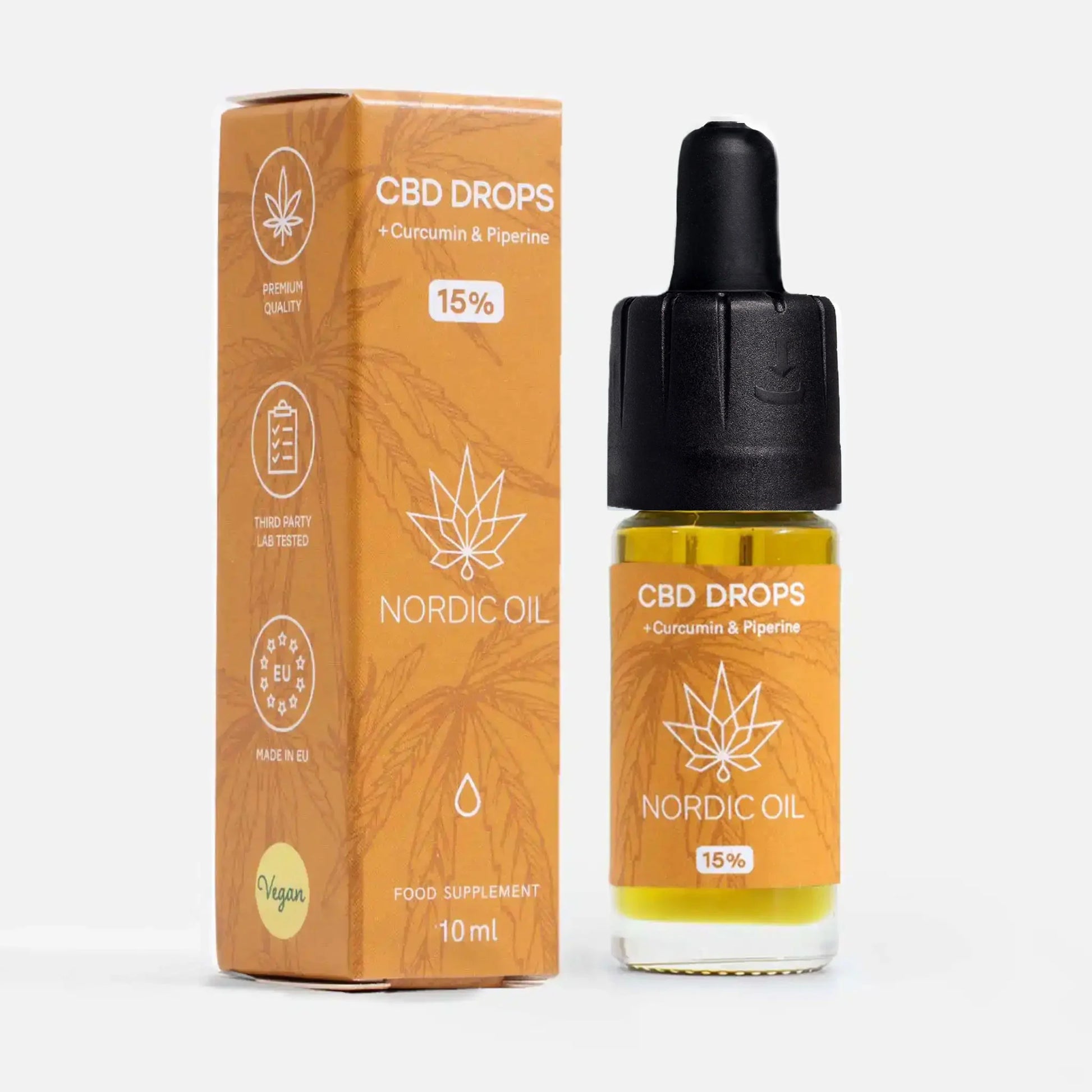 CBD Öl mit Kurkumin (15%) Flasche mit Kurkuma neben der Verpackung