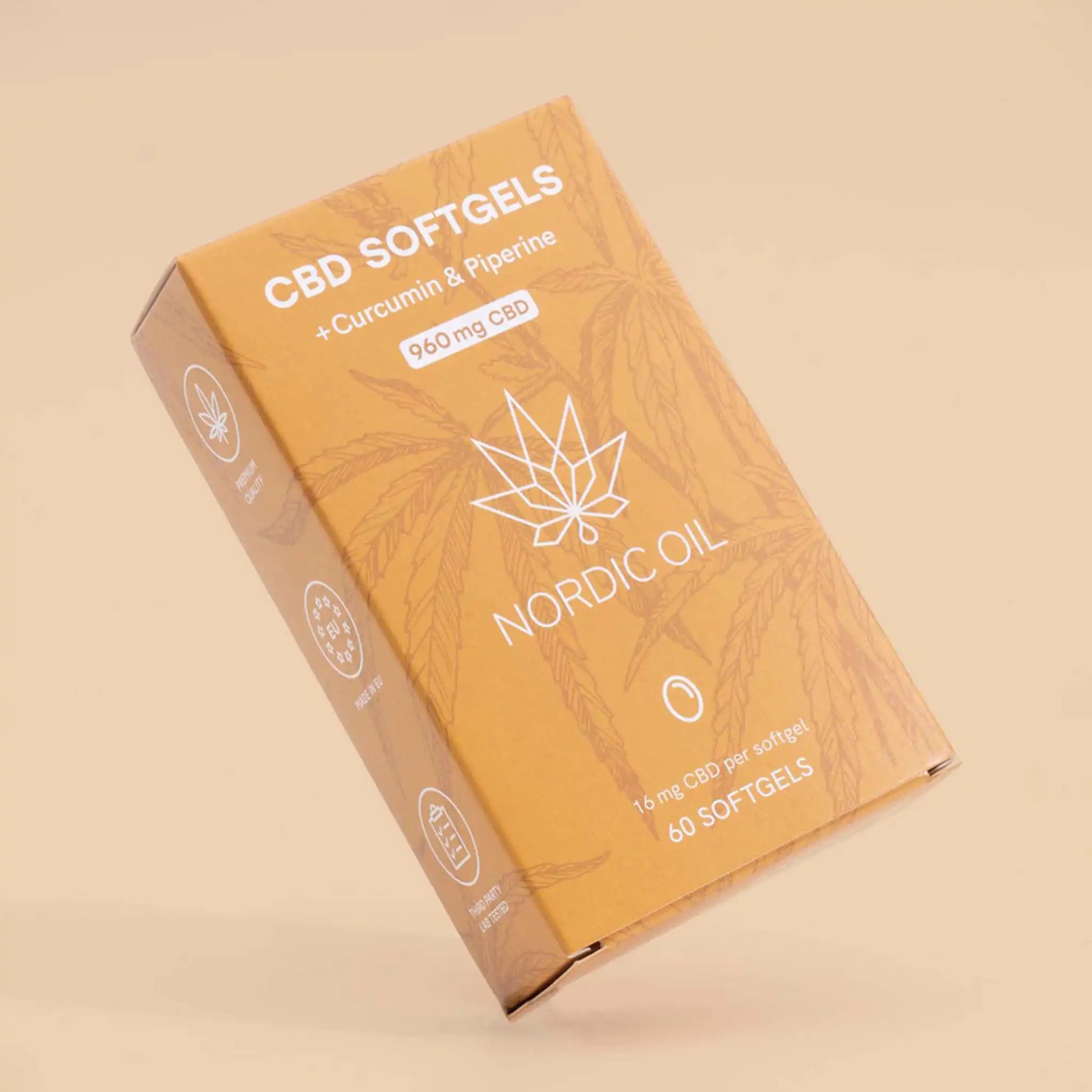 CBD Kapsel Packung steht schräg auf Orangenem Hintergrund